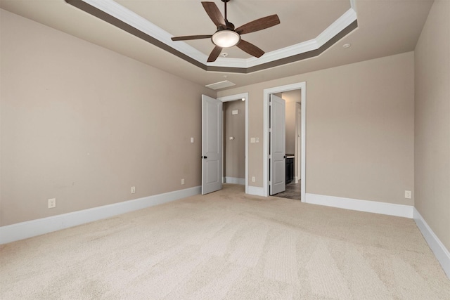 1715 Laremont Bend Dr, Spring, TX 77386 - unfurnished bedroom featuring a raised ceiling, ornamental molding, light colored carpet, baseboards, and ensuite bath