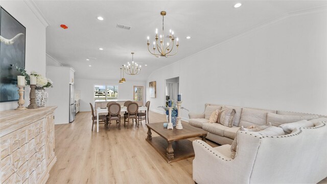 living area featuring visible vents, recessed lighting, a notable chandelier, and light wood-style floors