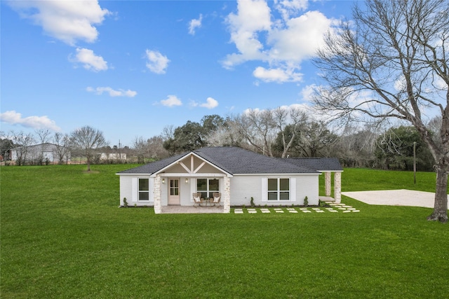rear view of house with a lawn