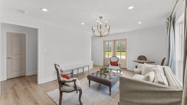 living area featuring recessed lighting, light wood-style floors, baseboards, and an inviting chandelier