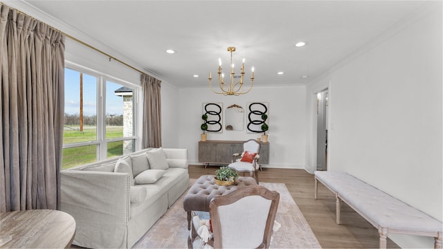 living room featuring a notable chandelier, baseboards, recessed lighting, crown molding, and light wood finished floors