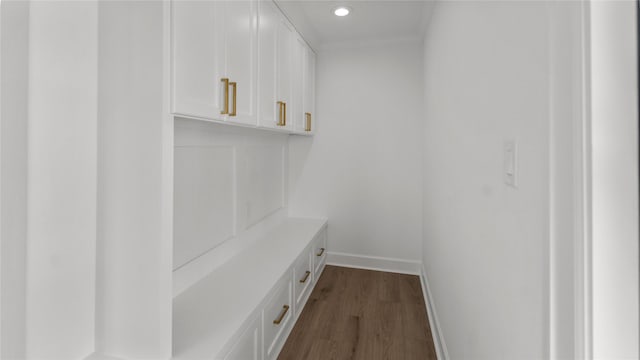 mudroom featuring dark wood-style flooring, ornamental molding, baseboards, and recessed lighting