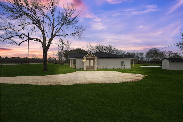 exterior space with gravel driveway and an outdoor structure