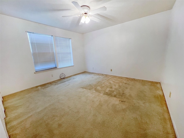 3203 Bayou Dr, La Porte, TX 77571 - spare room featuring carpet, a ceiling fan, and baseboards