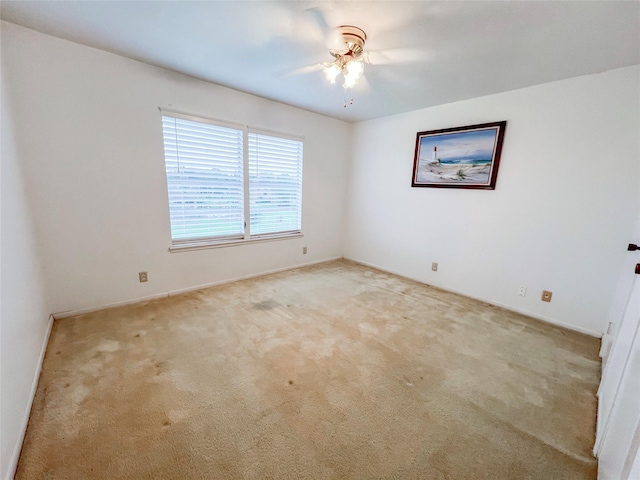 3203 Bayou Dr, La Porte, TX 77571 - spare room with carpet floors, a ceiling fan, and baseboards