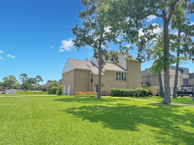 3203 Bayou Dr, La Porte, TX 77571 - view of home's exterior with a yard, brick siding, and an attached garage