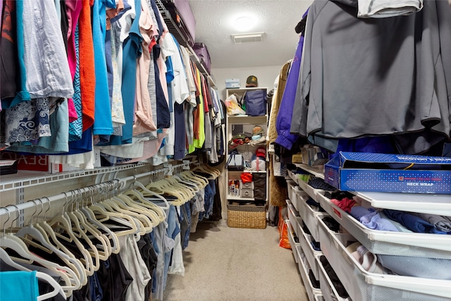 spacious closet featuring visible vents and carpet