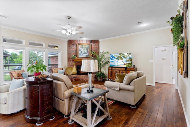 living room with crown molding, baseboards, a ceiling fan, and visible vents