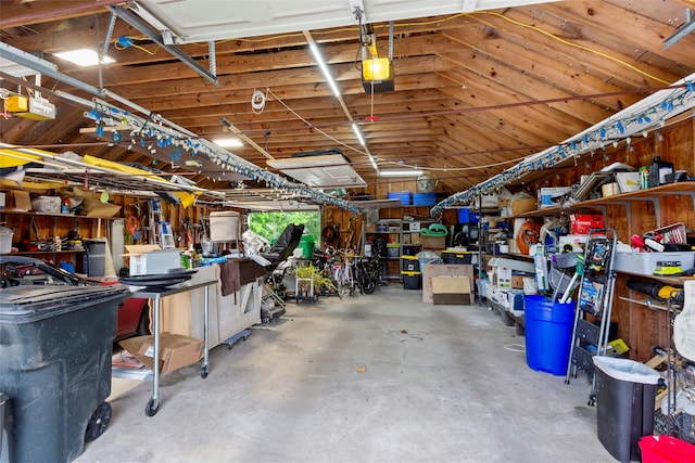 garage featuring a workshop area and a garage door opener