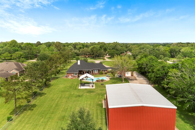 drone / aerial view featuring a view of trees