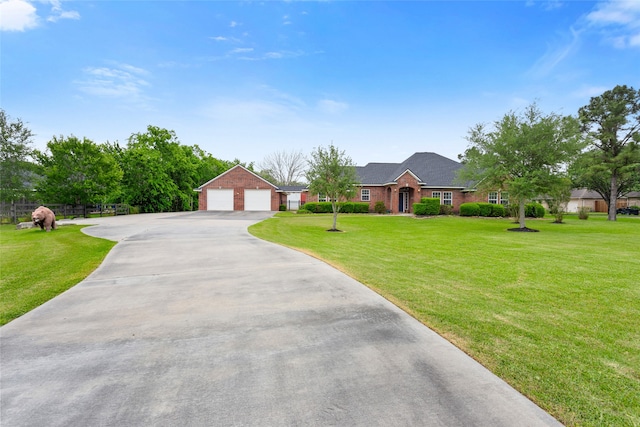 ranch-style home with brick siding, driveway, and a front yard