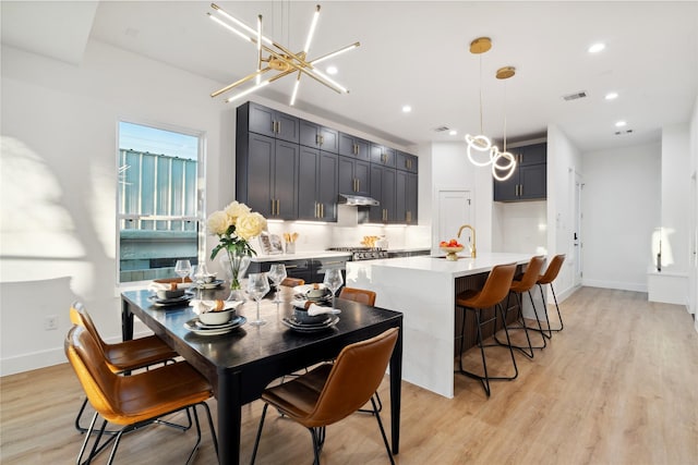 4323 Rogers St, Houston, TX 77022 - dining area featuring light wood-style floors, baseboards, visible vents, and recessed lighting