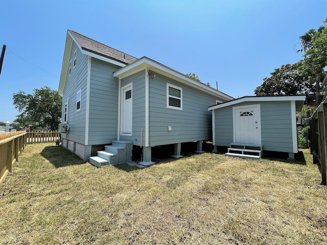1701 40th St, Galveston, TX 77550 - back of property with entry steps and an outbuilding