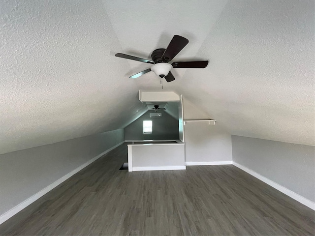 1701 40th St, Galveston, TX 77550 - bonus room featuring a ceiling fan, a textured ceiling, wood finished floors, baseboards, and lofted ceiling