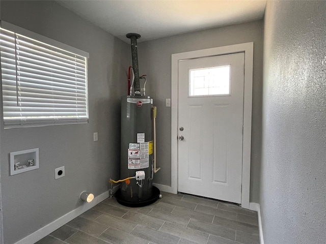 1701 40th St, Galveston, TX 77550 - laundry area with gas water heater, hookup for an electric dryer, washer hookup, and baseboards