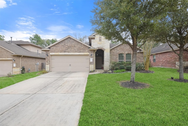 view of front of home with an attached garage, concrete driveway, a front lawn, and brick siding