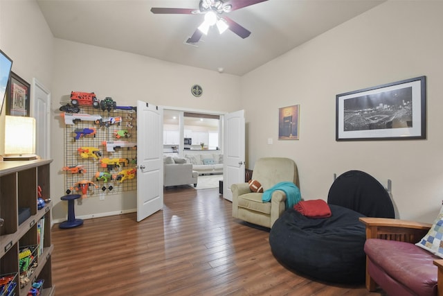 living area with wood finished floors and ceiling fan