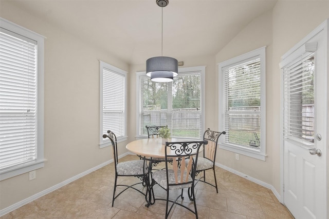 dining area featuring baseboards and light tile patterned flooring