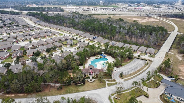 birds eye view of property with a residential view
