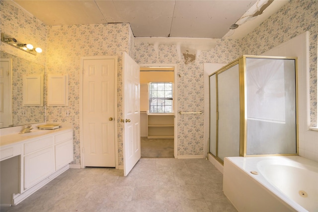 bathroom with wallpapered walls, tile patterned flooring, vanity, a garden tub, and a stall shower