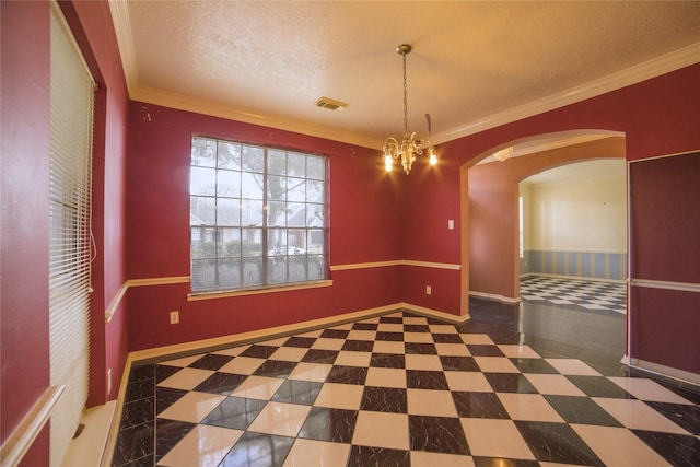 unfurnished dining area featuring arched walkways, visible vents, crown molding, and baseboards