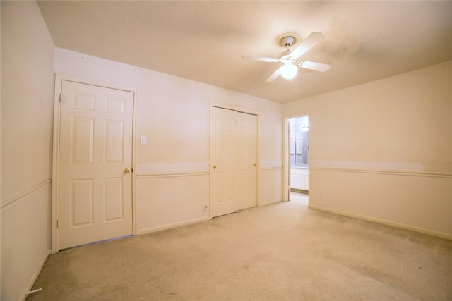 unfurnished bedroom with a ceiling fan, baseboards, carpet floors, and a closet