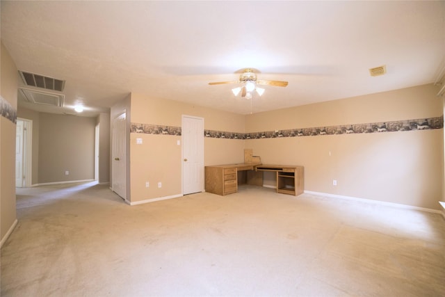 interior space with light carpet, a ceiling fan, and visible vents