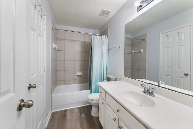 8322 Calico Canyon Dr, Tomball, TX 77375 - full bathroom with wood finished floors, vanity, toilet, and shower / tub combo with curtain