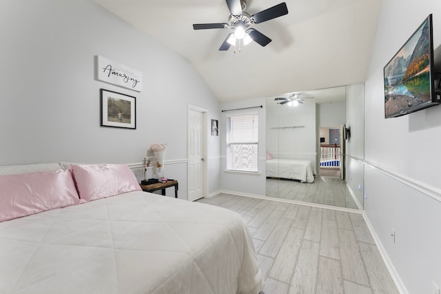 8322 Calico Canyon Dr, Tomball, TX 77375 - bedroom with wood finished floors, vaulted ceiling, a ceiling fan, and baseboards