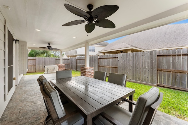 8322 Calico Canyon Dr, Tomball, TX 77375 - view of patio featuring ceiling fan, a fenced backyard, and outdoor dining space