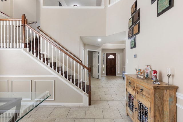 8322 Calico Canyon Dr, Tomball, TX 77375 - tiled entryway with a towering ceiling, stairs, recessed lighting, and baseboards