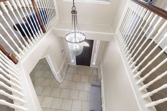 8322 Calico Canyon Dr, Tomball, TX 77375 - foyer featuring tile patterned flooring and baseboards