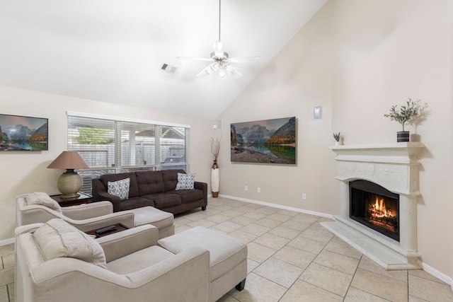 8322 Calico Canyon Dr, Tomball, TX 77375 - living room featuring a warm lit fireplace, baseboards, high vaulted ceiling, ceiling fan, and light tile patterned flooring