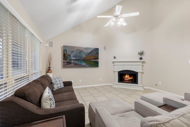 8322 Calico Canyon Dr, Tomball, TX 77375 - living area featuring high vaulted ceiling, a warm lit fireplace, light tile patterned flooring, a ceiling fan, and baseboards
