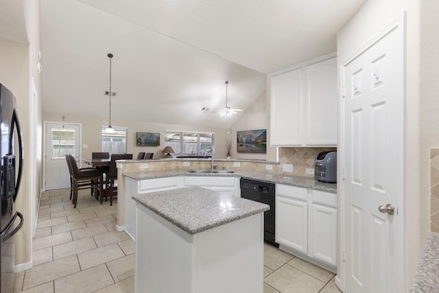 8322 Calico Canyon Dr, Tomball, TX 77375 - kitchen with black dishwasher, a sink, a peninsula, a kitchen island, and fridge with ice dispenser