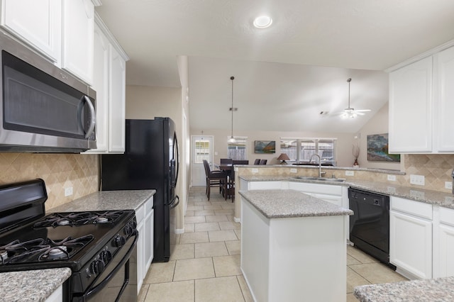 8322 Calico Canyon Dr, Tomball, TX 77375 - kitchen with black appliances, a sink, plenty of natural light, a ceiling fan, and lofted ceiling