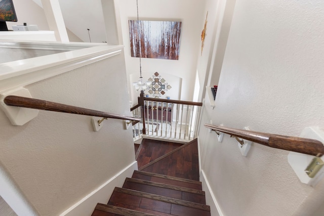 8322 Calico Canyon Dr, Tomball, TX 77375 - stairway with a textured wall and wood finished floors