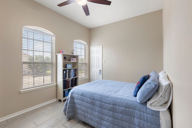 8322 Calico Canyon Dr, Tomball, TX 77375 - bedroom featuring light wood-style flooring, baseboards, and ceiling fan