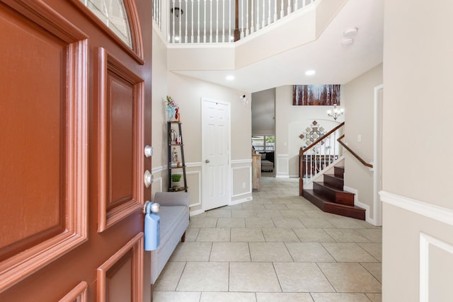 8322 Calico Canyon Dr, Tomball, TX 77375 - entryway with stairway, a towering ceiling, light tile patterned flooring, recessed lighting, and radiator