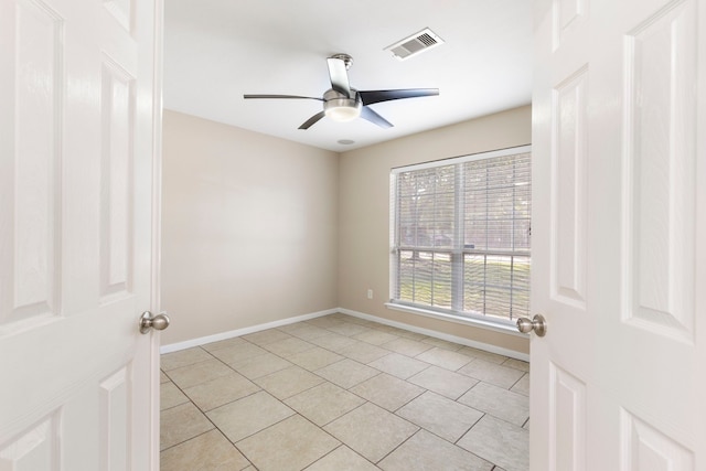 8322 Calico Canyon Dr, Tomball, TX 77375 - unfurnished room with light tile patterned floors, ceiling fan, and baseboards