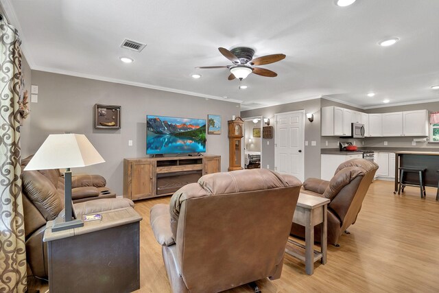 310 Hidden Oaks Dr, Point Blank, TX 77364 - living area with ornamental molding, visible vents, and ceiling fan