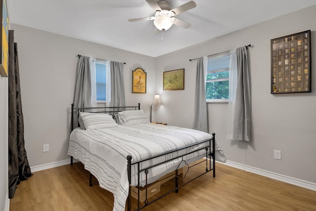 310 Hidden Oaks Dr, Point Blank, TX 77364 - bedroom with baseboards, a ceiling fan, and light wood-type flooring