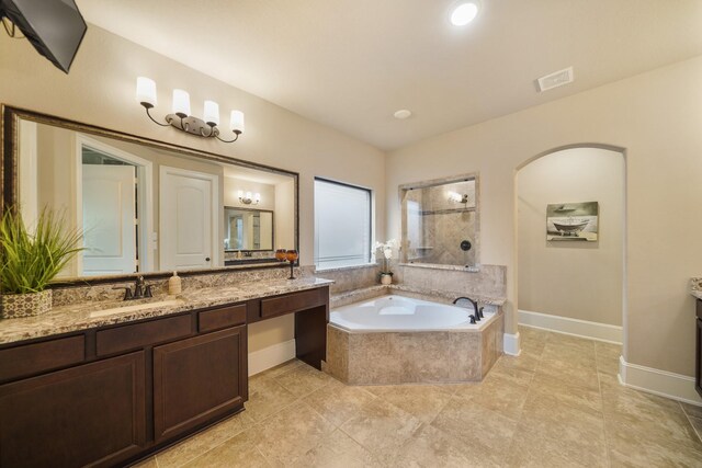 3225 Summer Tanager Ln, Manvel, TX 77578 - full bath with vanity, a garden tub, baseboards, and tile patterned floors