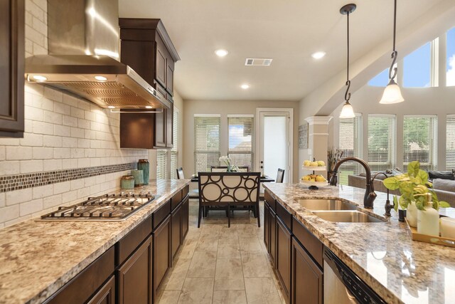 3225 Summer Tanager Ln, Manvel, TX 77578 - kitchen with wall chimney range hood, a sink, healthy amount of natural light, appliances with stainless steel finishes, and recessed lighting