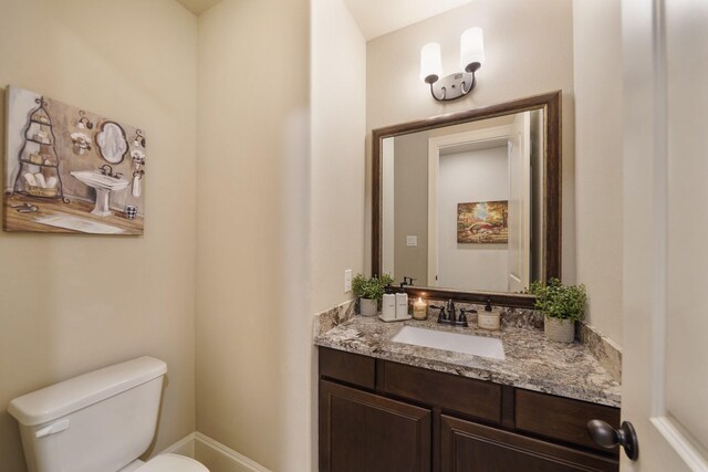 3225 Summer Tanager Ln, Manvel, TX 77578 - bathroom with toilet, vanity, and baseboards