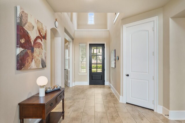 3225 Summer Tanager Ln, Manvel, TX 77578 - entryway featuring baseboards and arched walkways