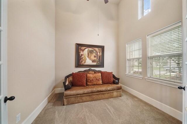3225 Summer Tanager Ln, Manvel, TX 77578 - sitting room with carpet floors, healthy amount of natural light, a high ceiling, a ceiling fan, and baseboards
