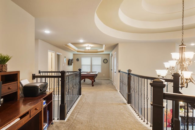 3225 Summer Tanager Ln, Manvel, TX 77578 - corridor with a tray ceiling, light colored carpet, an upstairs landing, recessed lighting, and a chandelier