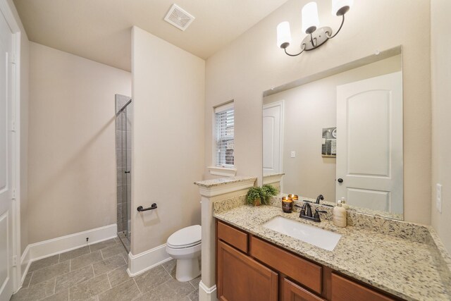 3225 Summer Tanager Ln, Manvel, TX 77578 - full bathroom featuring a stall shower, toilet, vanity, and baseboards