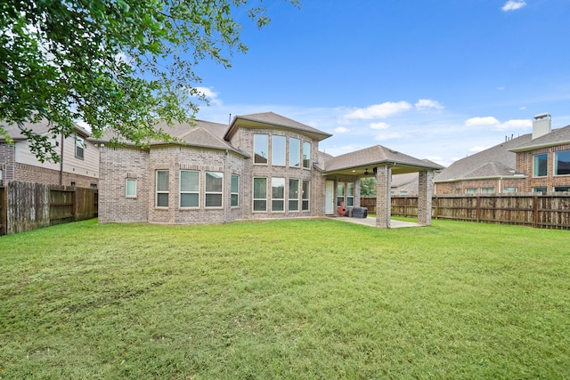3225 Summer Tanager Ln, Manvel, TX 77578 - rear view of house with brick siding and a patio